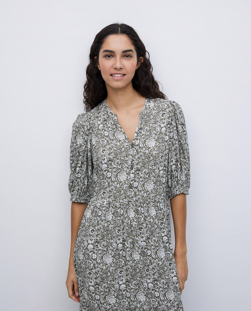 3/4 length sleeve full length dress with v neck. Detailed green and white floral print design. 