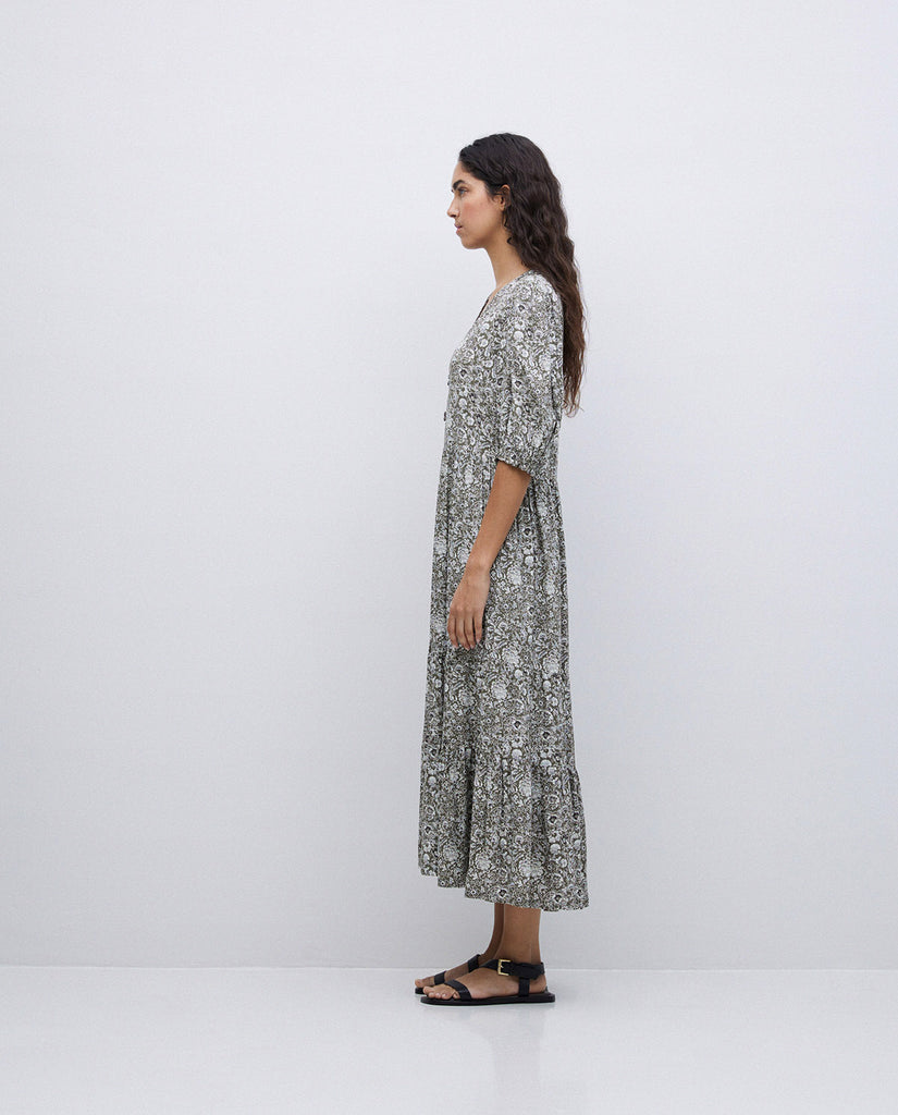 3/4 length sleeve full length dress with v neck. Detailed green and white floral print design. 