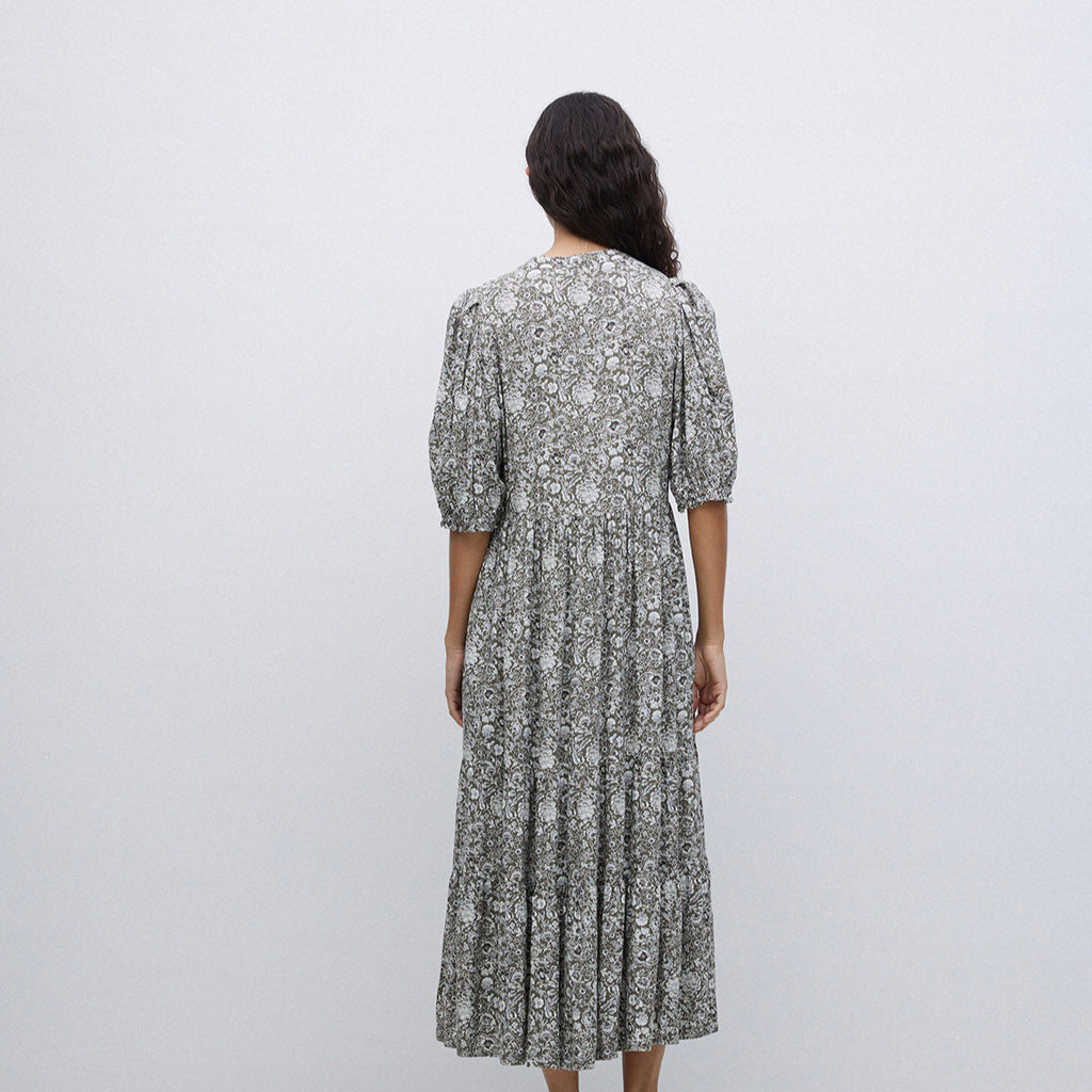 3/4 length sleeve full length dress with v neck. Detailed green and white floral print design. 