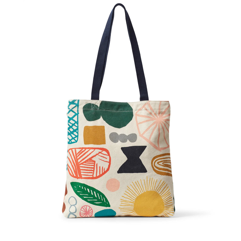 A patterned tote bag by Donna Wilson featuring teal, orange, green, yellow, black, and pink designs on a cream background.