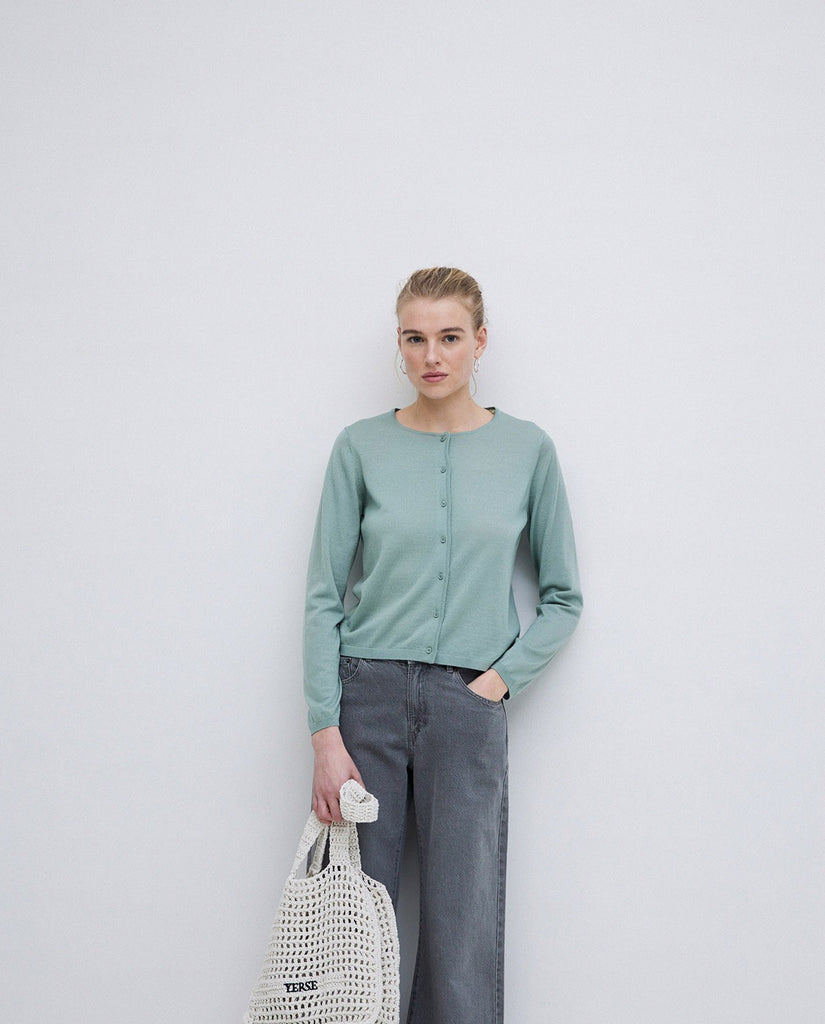 Soft blue green merino wool cardigan with full length sleeves and button front. 