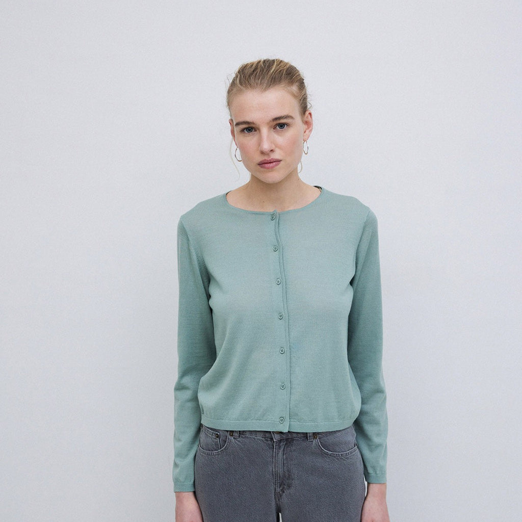 Soft blue green merino wool cardigan with full length sleeves and button front. 