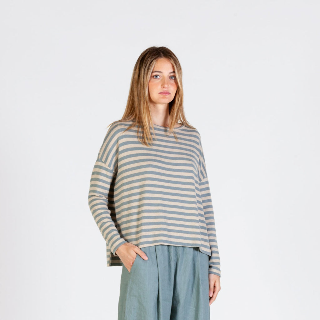 pale blue and oatmeal striped round neck jumper. Featuring dipped back hem and drop shoulders. 