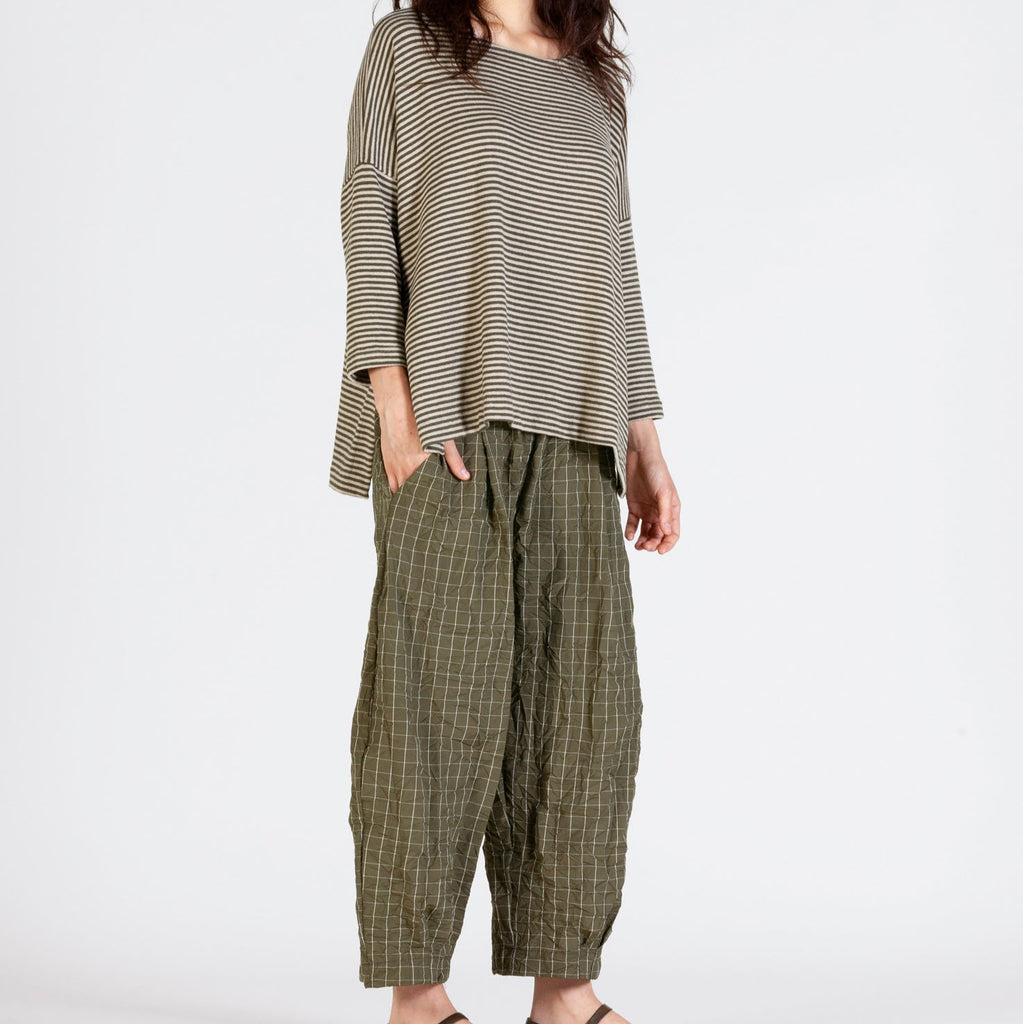 Alga green and oatmeal / white striped top with slight split side, dipped back hemp and drop shoulders styled with crinkle bubble trousers in alga green with oatmeal / white thin grid pattern 