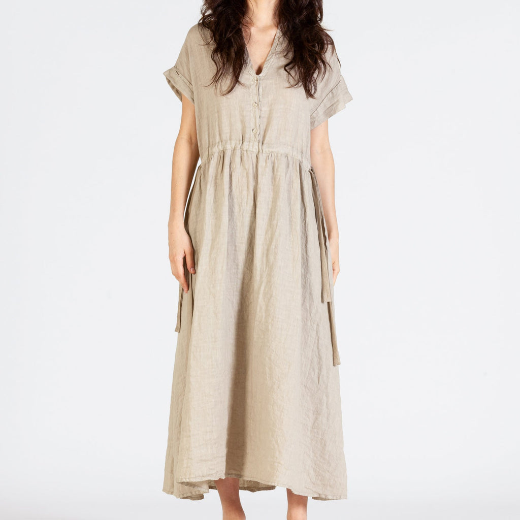 Loose fit, Beige ankle length dress with v-neck, short sleeves and slight tapering in on the waist. 