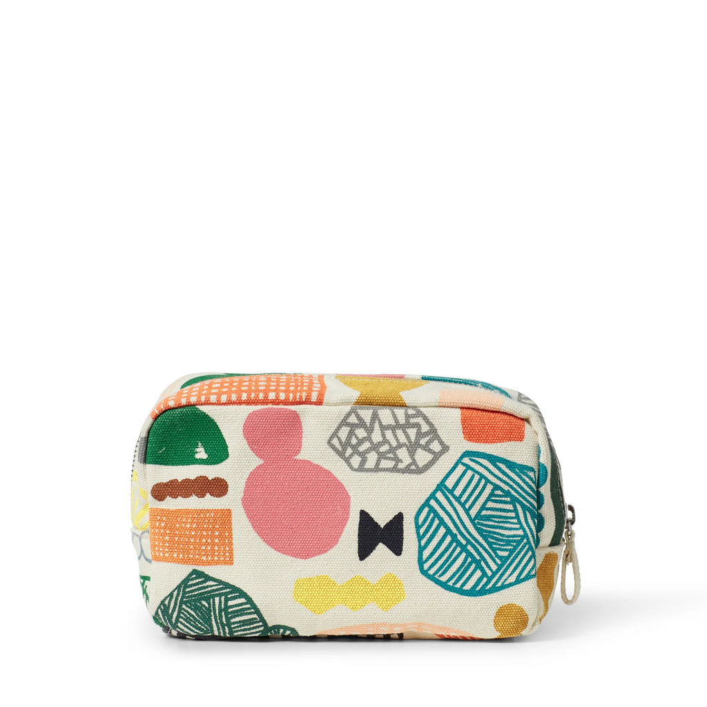 Colorful zip pouch by Donna Wilson, featuring green, pink, yellow, orange, and blue patterns on a cream background.